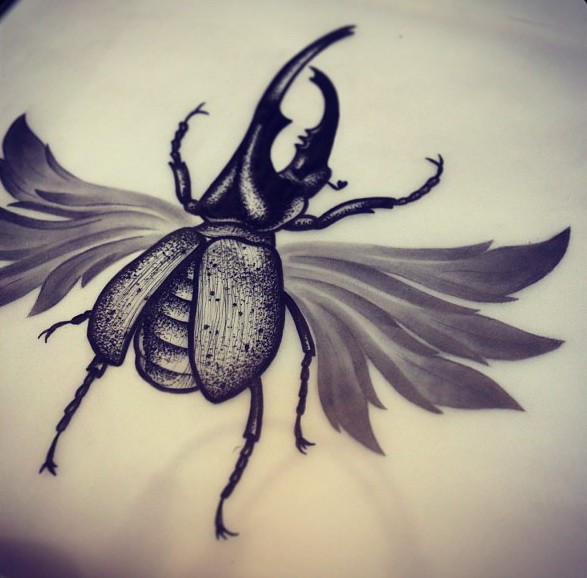 Black-ink bug with sharp horn and grey tender wings tattoo design