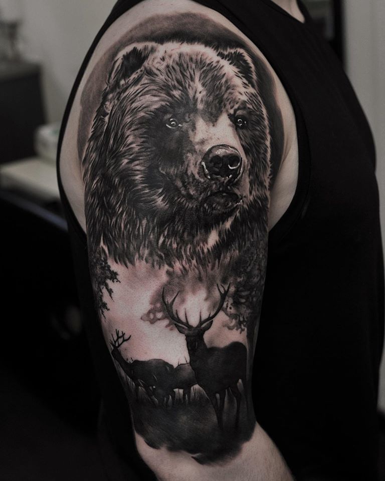Black and white bear tattoo on shoulder