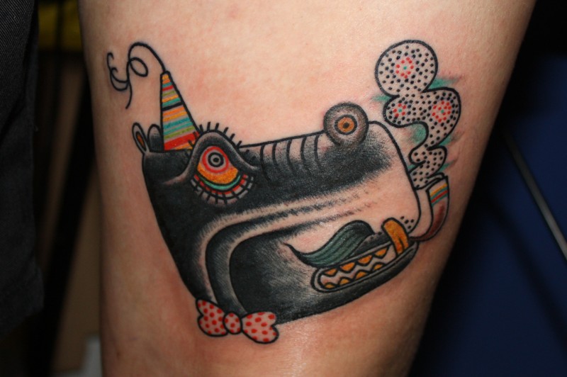 Black happy hippo head in bow-tie with tobacco pipe tattoo