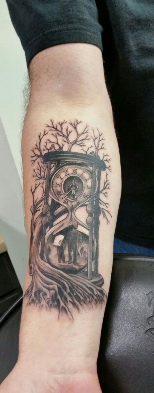 Black hourglass with tree of life forearm tatoo