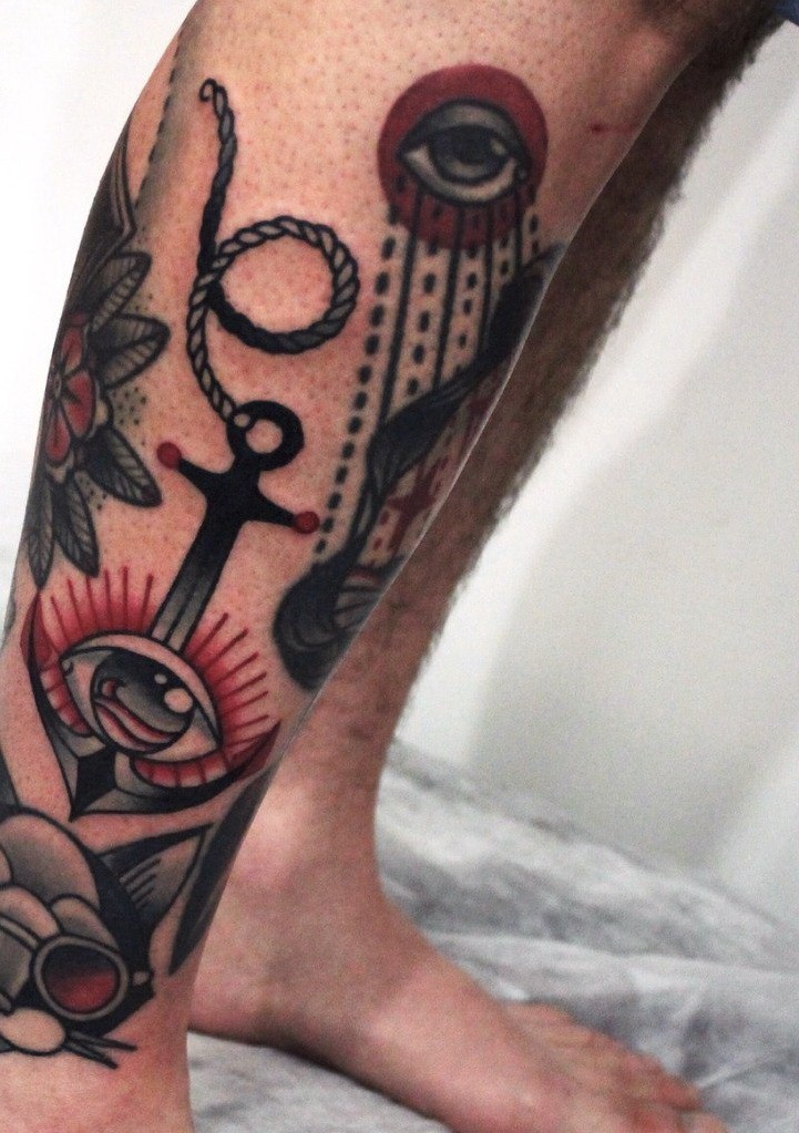 Black old school anchor with shining eye tattoo for guys on shin