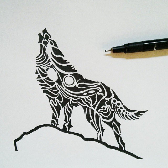 Black tribal howling wolf standing on the hill tattoo design