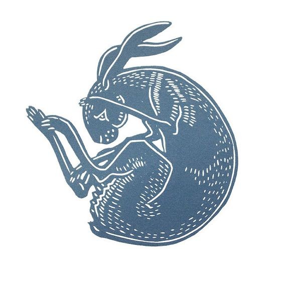 Blue-ink curled falling hare tattoo design