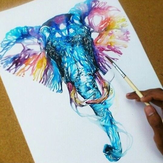 Blue watercolor elephant head with purple-and-yellow ears tattoo design