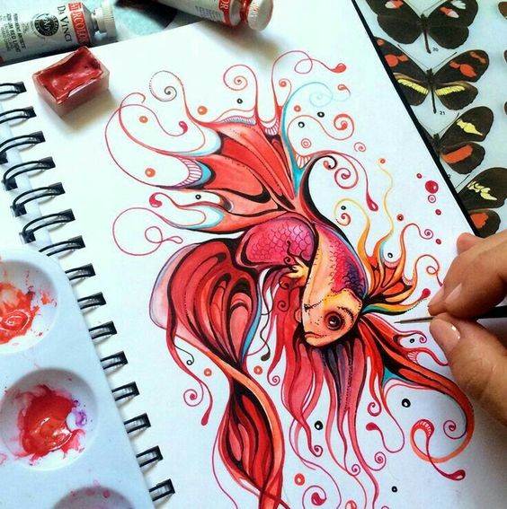 Bonny red gold fish with swirly flippers tattoo design