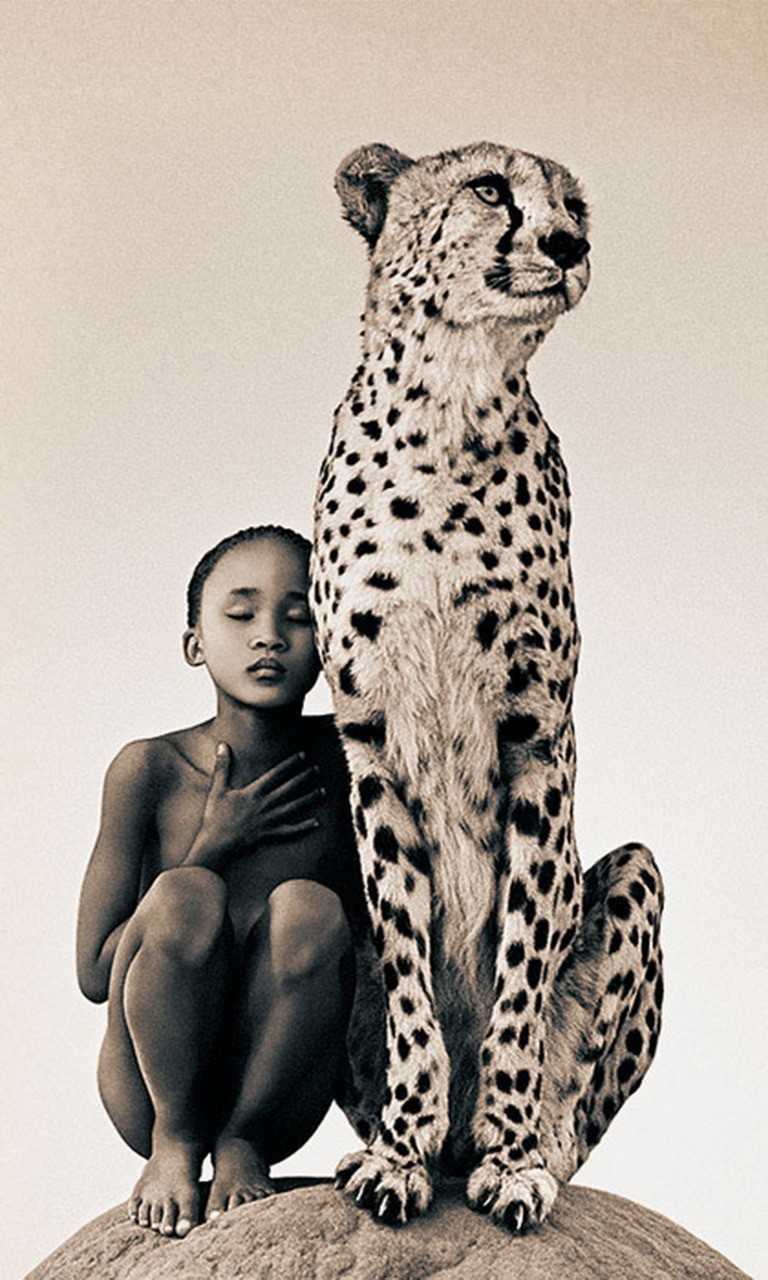 Calm elegant cheetah sitting with human boy tattoo design