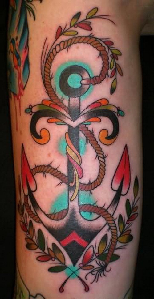 Charming old school anchor in greenery tattoo on forearm