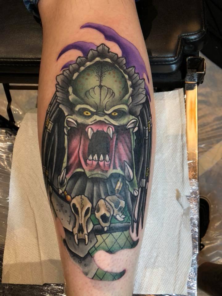 Colorful predator tattoo on leg