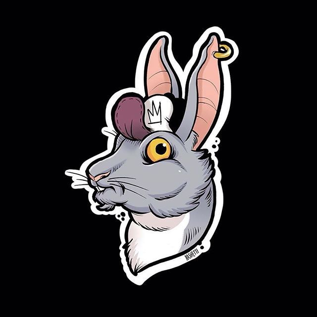 Colorful rabbit head in tiny cap tattoo design