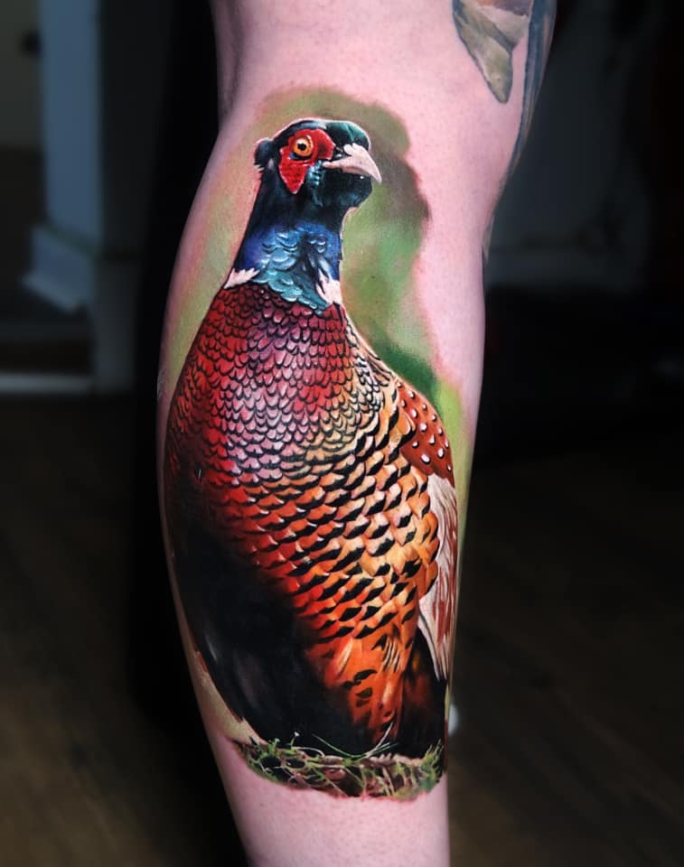 Colorful realistic Pheasant tattoo on leg