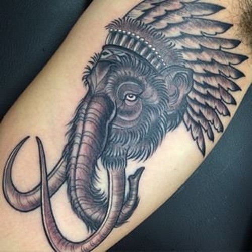 Cool black-and-white indian mammoth tattoo on upper arm