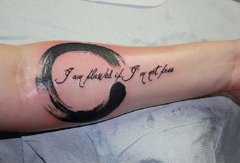 Cool black-lettered quote with harsh black circle tattoo for men on arm