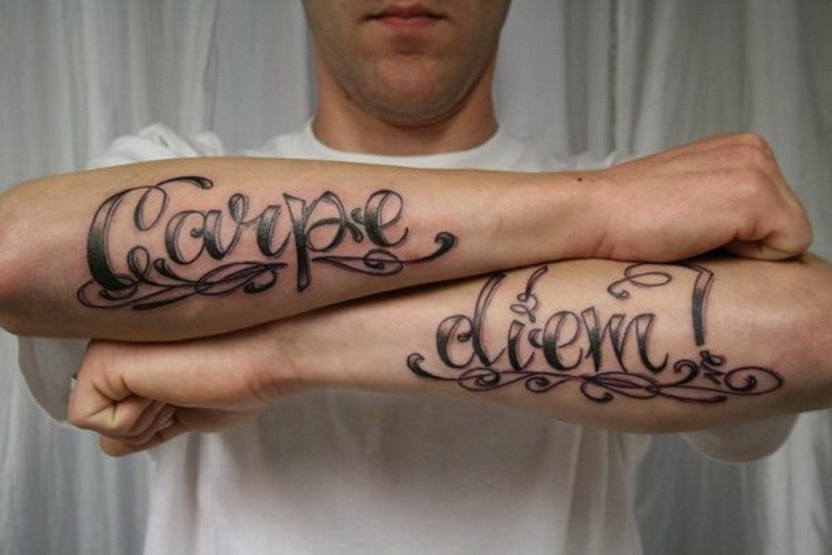 Cool carpe diem latin quote tattoo on arm