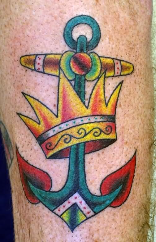 Cool colored old school anchor with yellow-crown tattoo on forearm