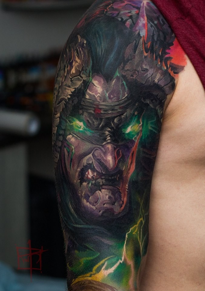 Cool demonic face tattoo on shoulder
