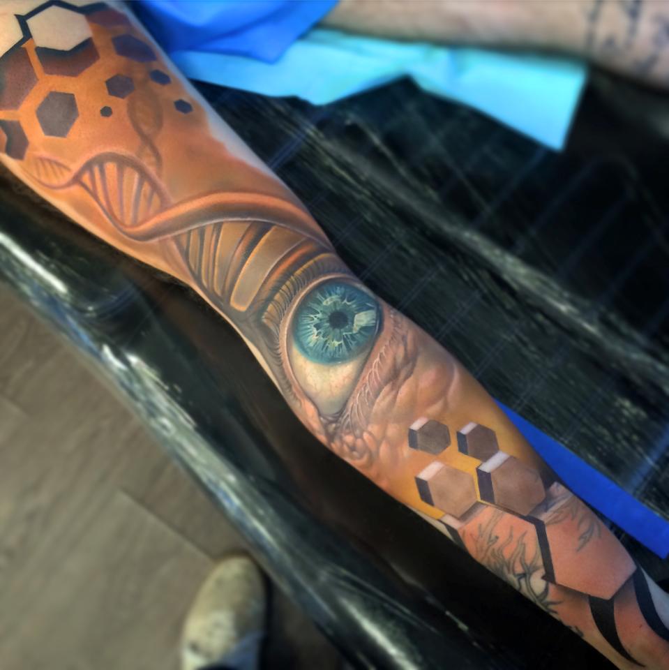 Cool full sleeve tattoo with eye and 3d hexagons