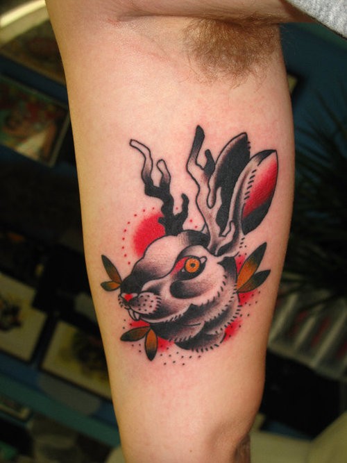 Cool old school hare with deer horns tattoo on arm