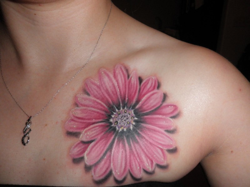 Cool pink daisy flower tattoo on chest