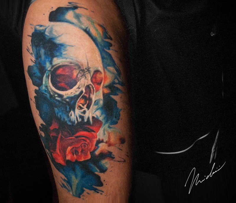 Cool skull and rose tattoo on shoulder