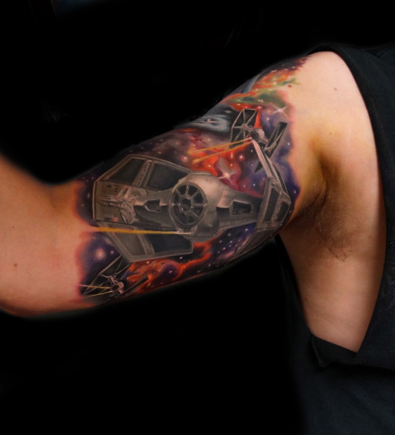 Cool star wars theme tattoo on biceps