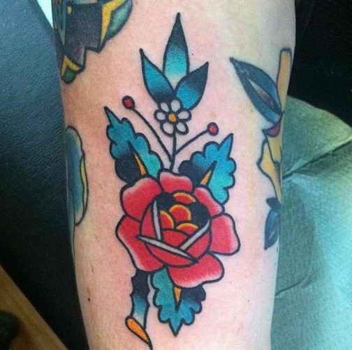 Cool traditional flower tattoo on arm