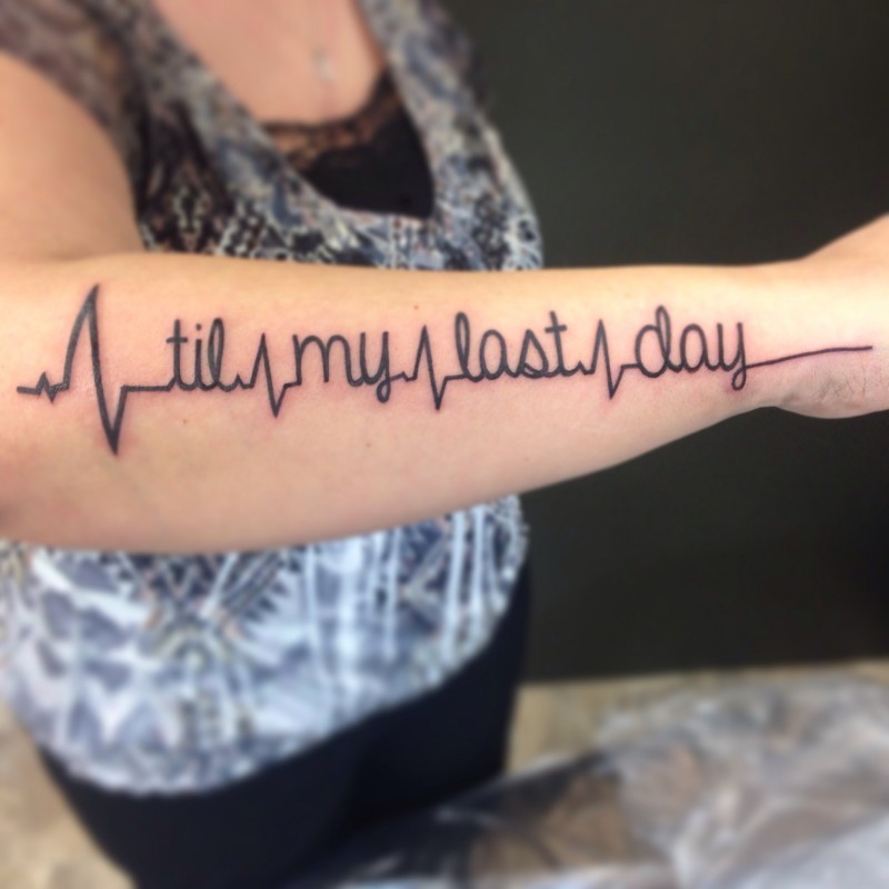Creative life heartbeat tattoo quote on arm