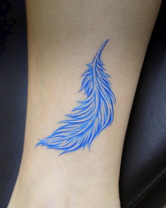 Cute blue feather tattoo on leg