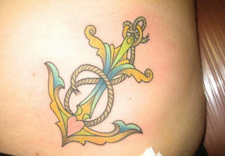 Cute colored anchor with rope and heart tattoo on belly