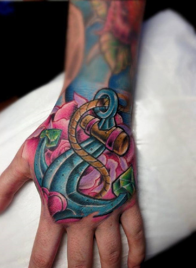 Cute colored old school anchor with roses tattoo on hand