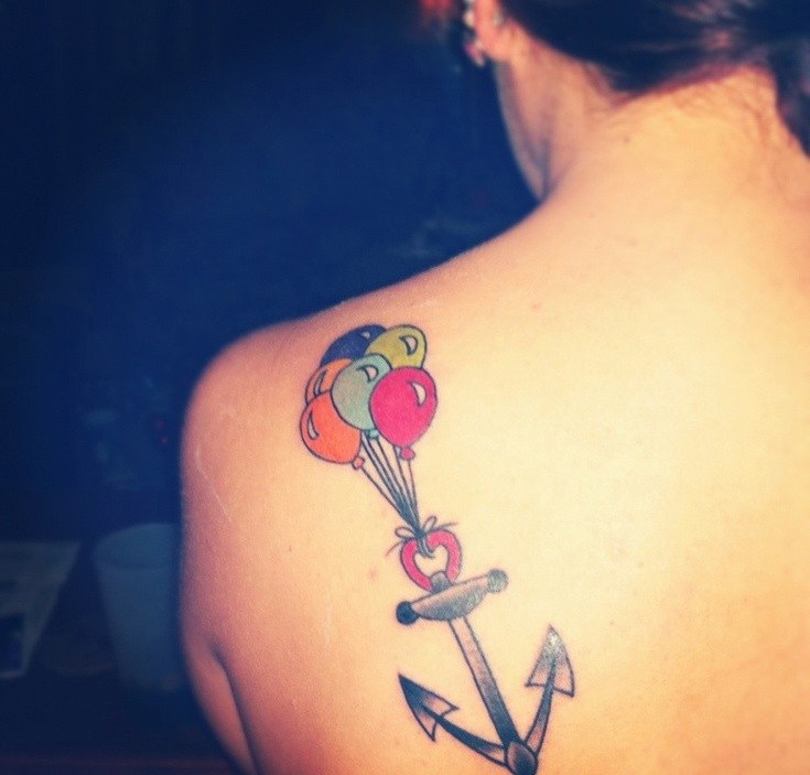 Cute neutral anchor with colored balloons tattoo on back