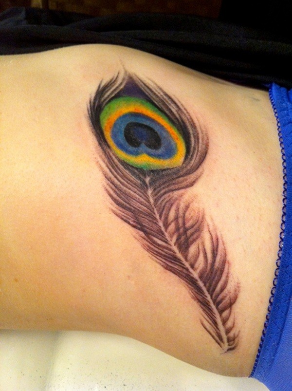 Cute peacock feather tattoo on belly