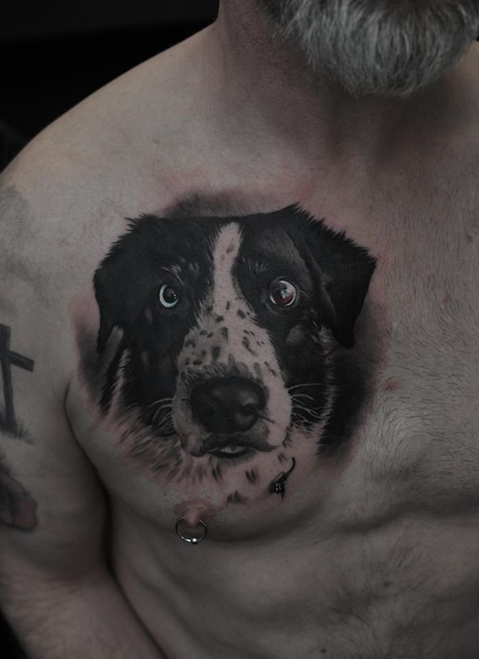Cute realistic dog tattoo on chest