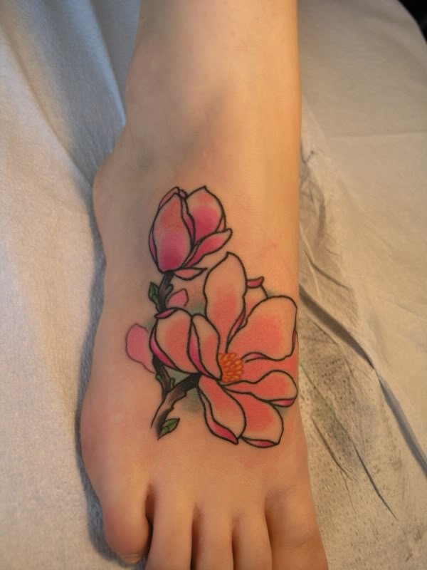 Cute rosy maglolia flower tattoo on foot