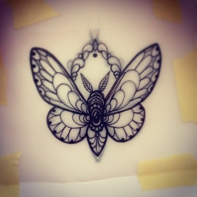 Decorated uncolored moth tattoo design