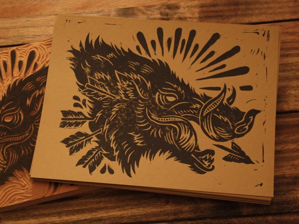 Dire black-ink wild pig head with arrows in shine tattoo design