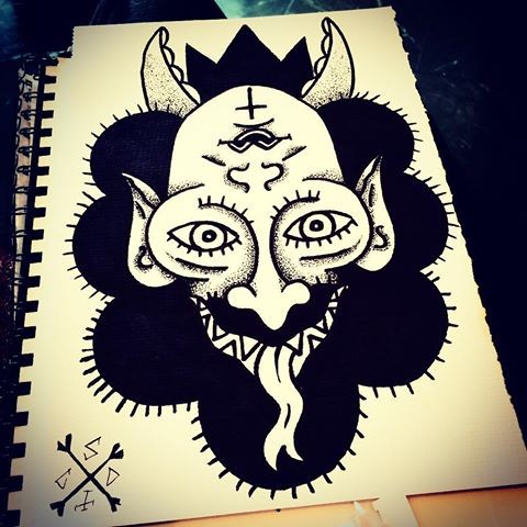 Dotwork-style devil face on black background tattoo design