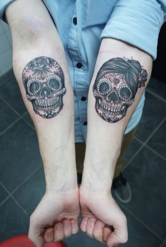 Double amuse girly muerte skull tattoo on forearms