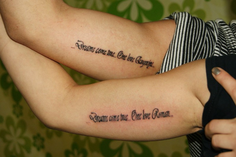 Dreams come true romantic double quote tattoo on arms