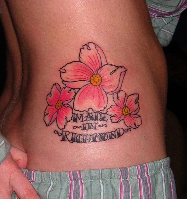 Elegant colorful hawaiian flowers with quote tattoo on side
