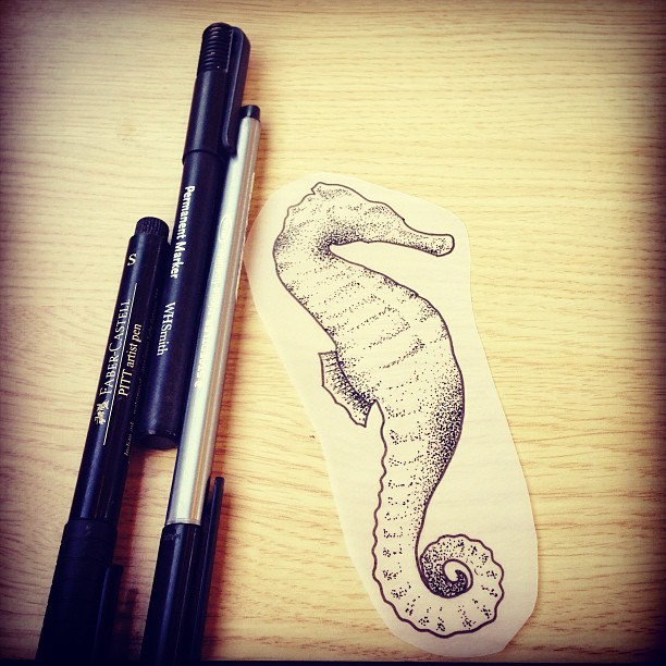 Elegant dotwork seahorse tattoo design