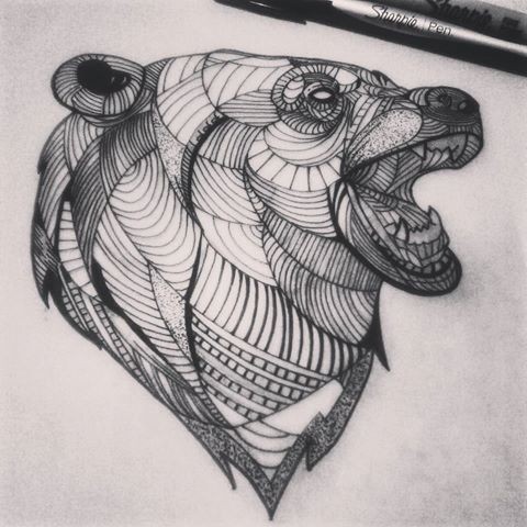 Exiting line-patterned grizzly head in profile tattoo design