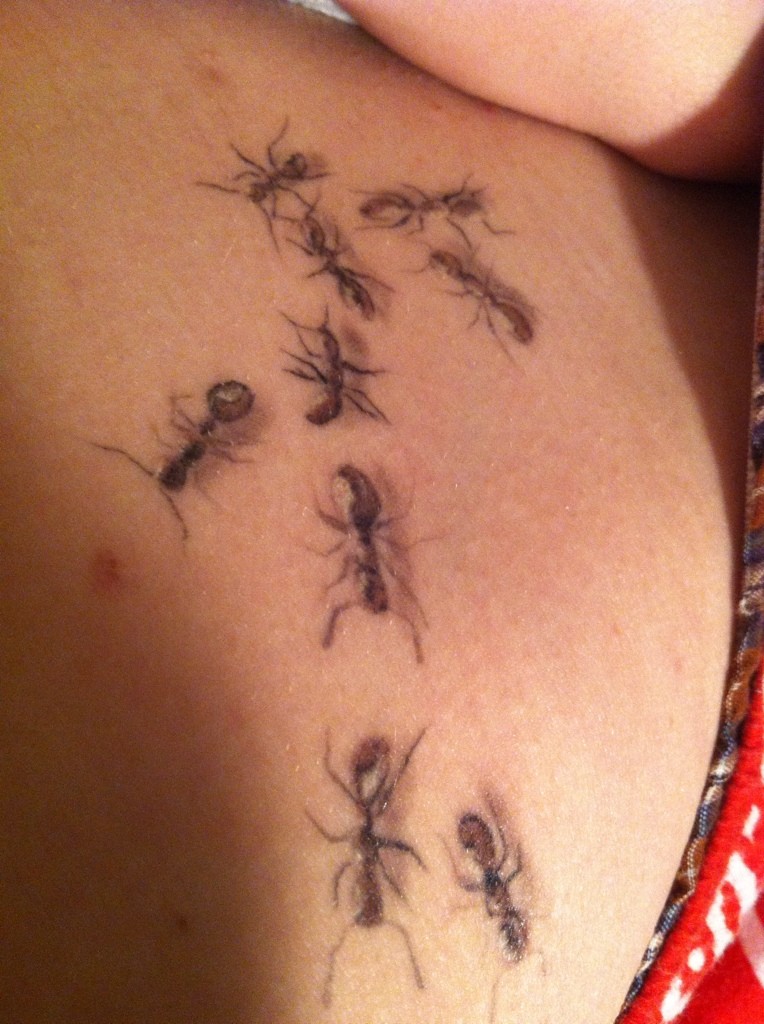 Exiting realistic flock of ants tattoo
