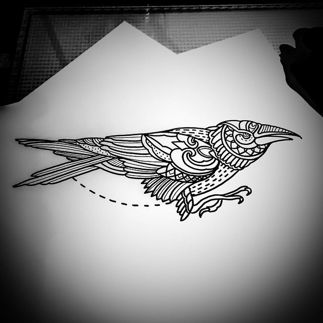 Fantastic black-and-white bird and dotted circle tattoo design