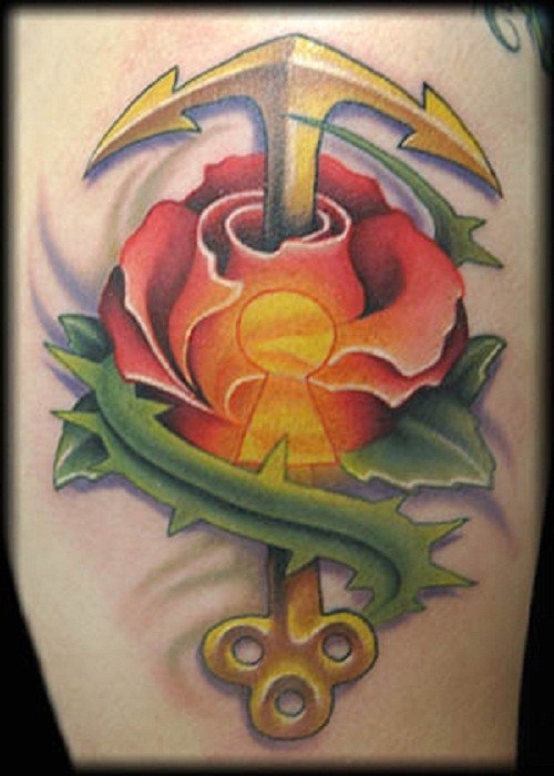 Fantastic golden anchor-key piercing rose tattoo on thigh