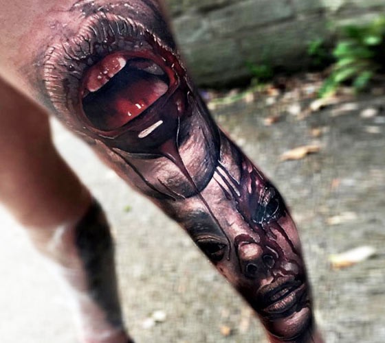 Fantastic painted colored whole leg tattoo of bloody human mouth with face