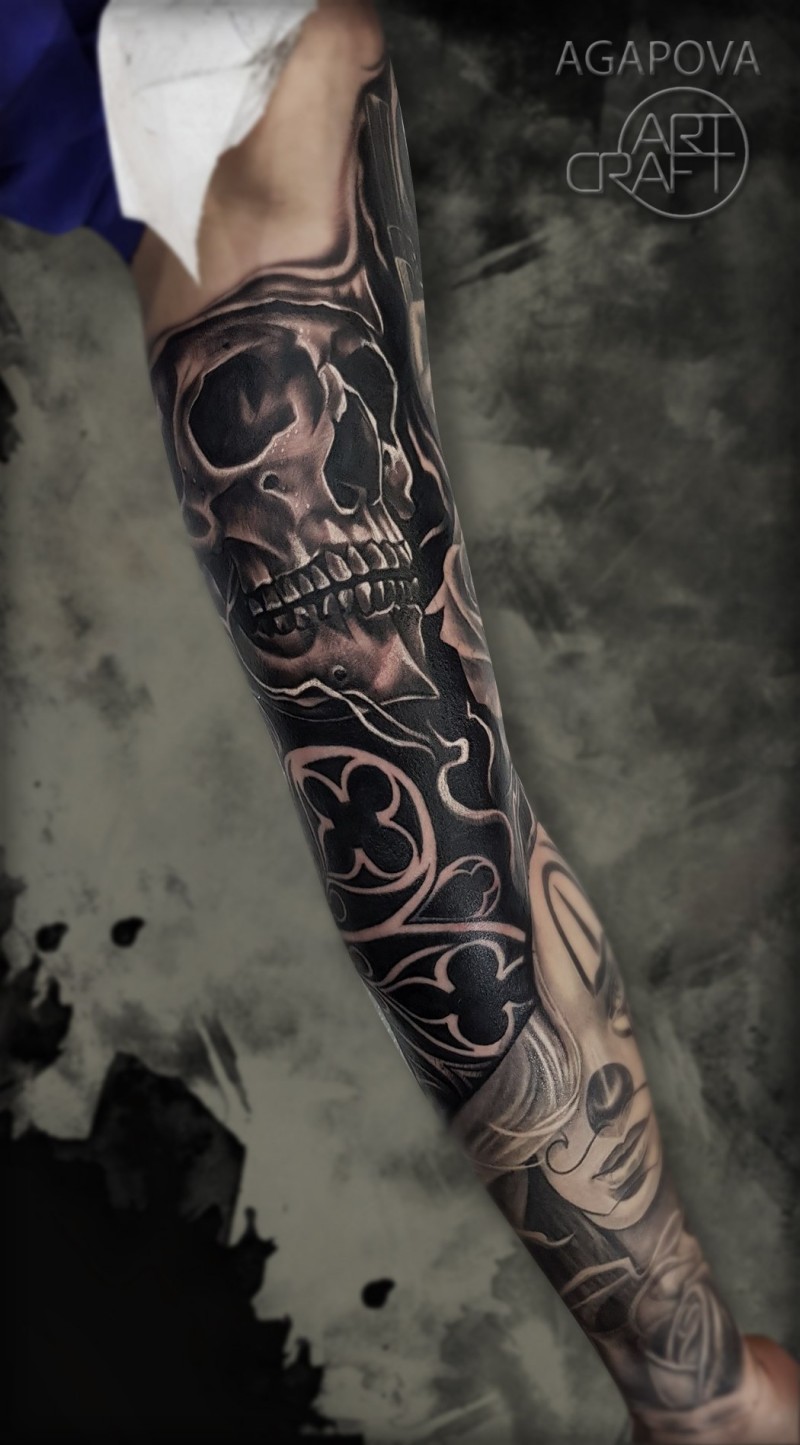 Full sleeve tattoo with skull