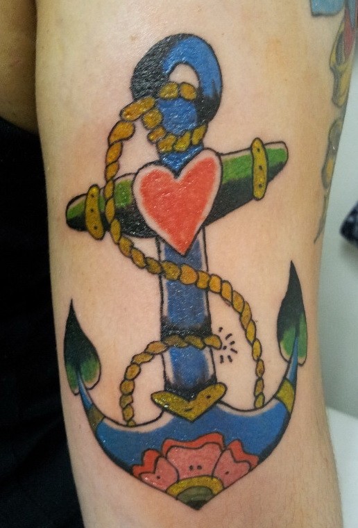 Funny blue old school anchor with red heart tattoo on forearm