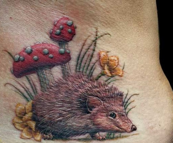 Funny colorful hedgehog in garden tattoo on lower back