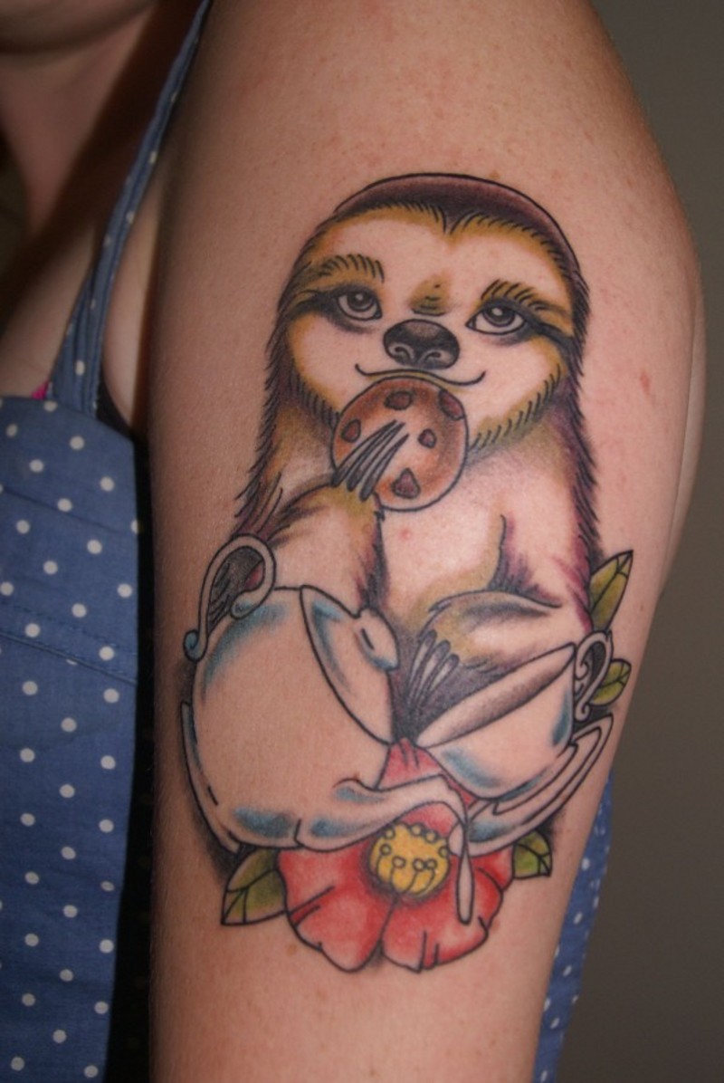 Funny designed cartoon like colored animal sloth with tea and cookies tattoo on shoulder