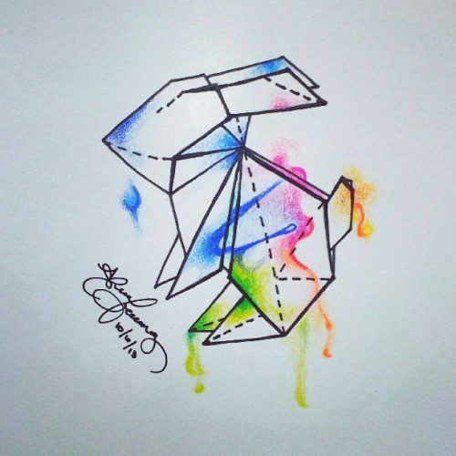 Geometric origami rabbit with rainbow watercolor effect tattoo design